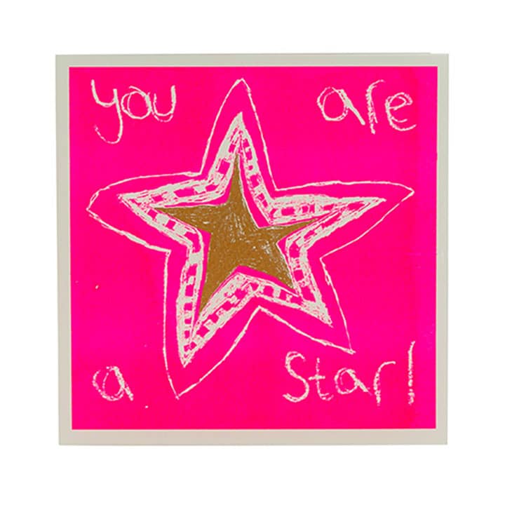 gold star on pink background