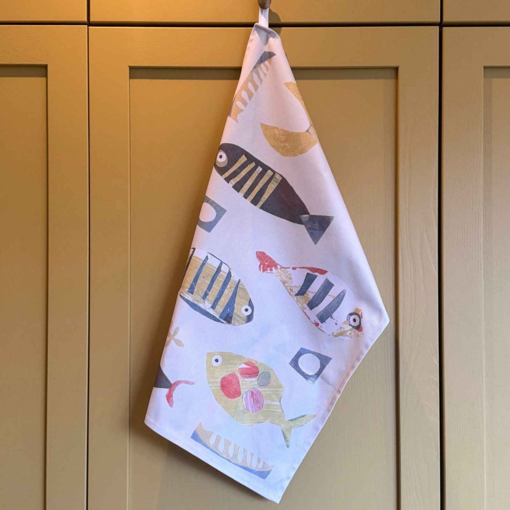 fish teatowel on cupboard