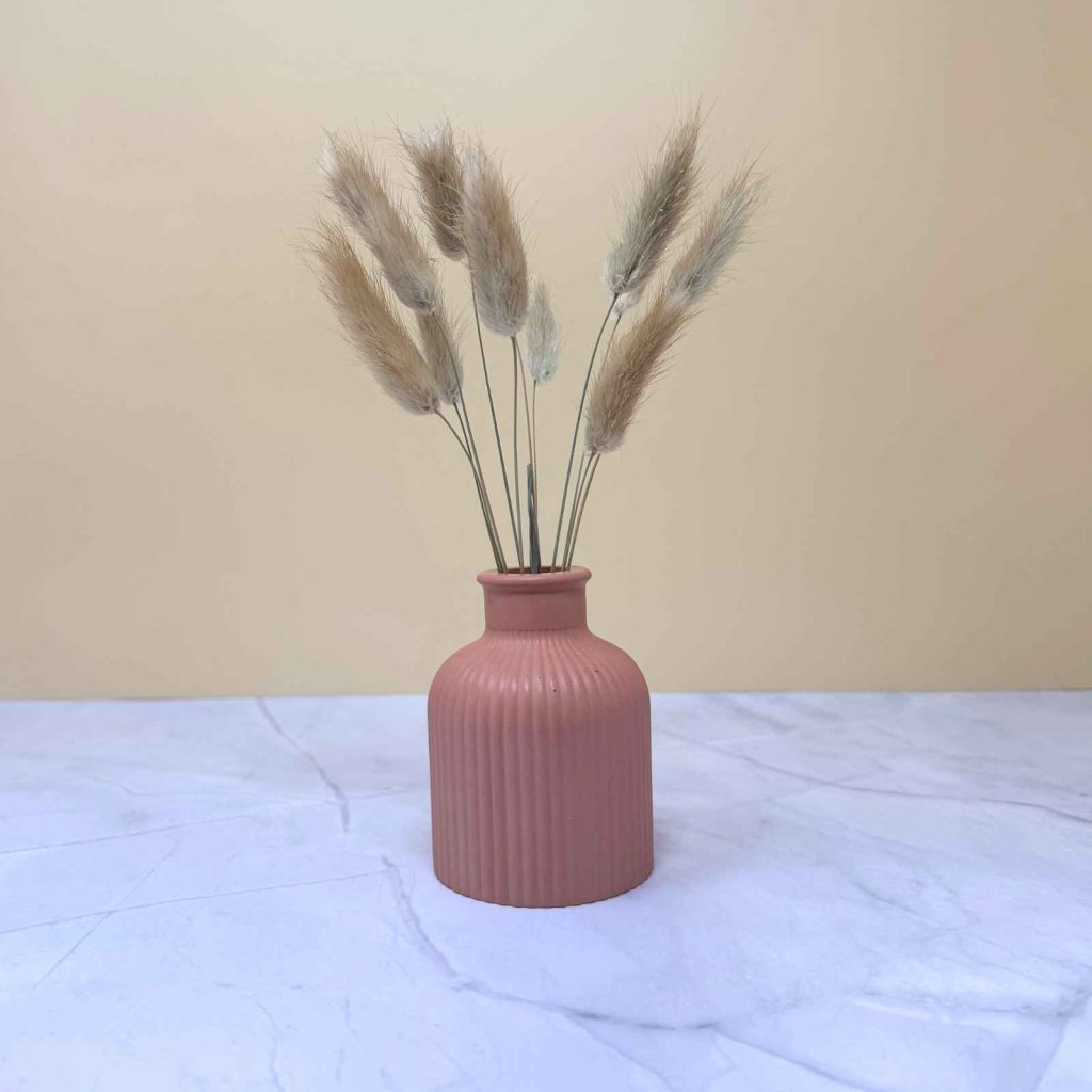 terracotta vase with dried flowers