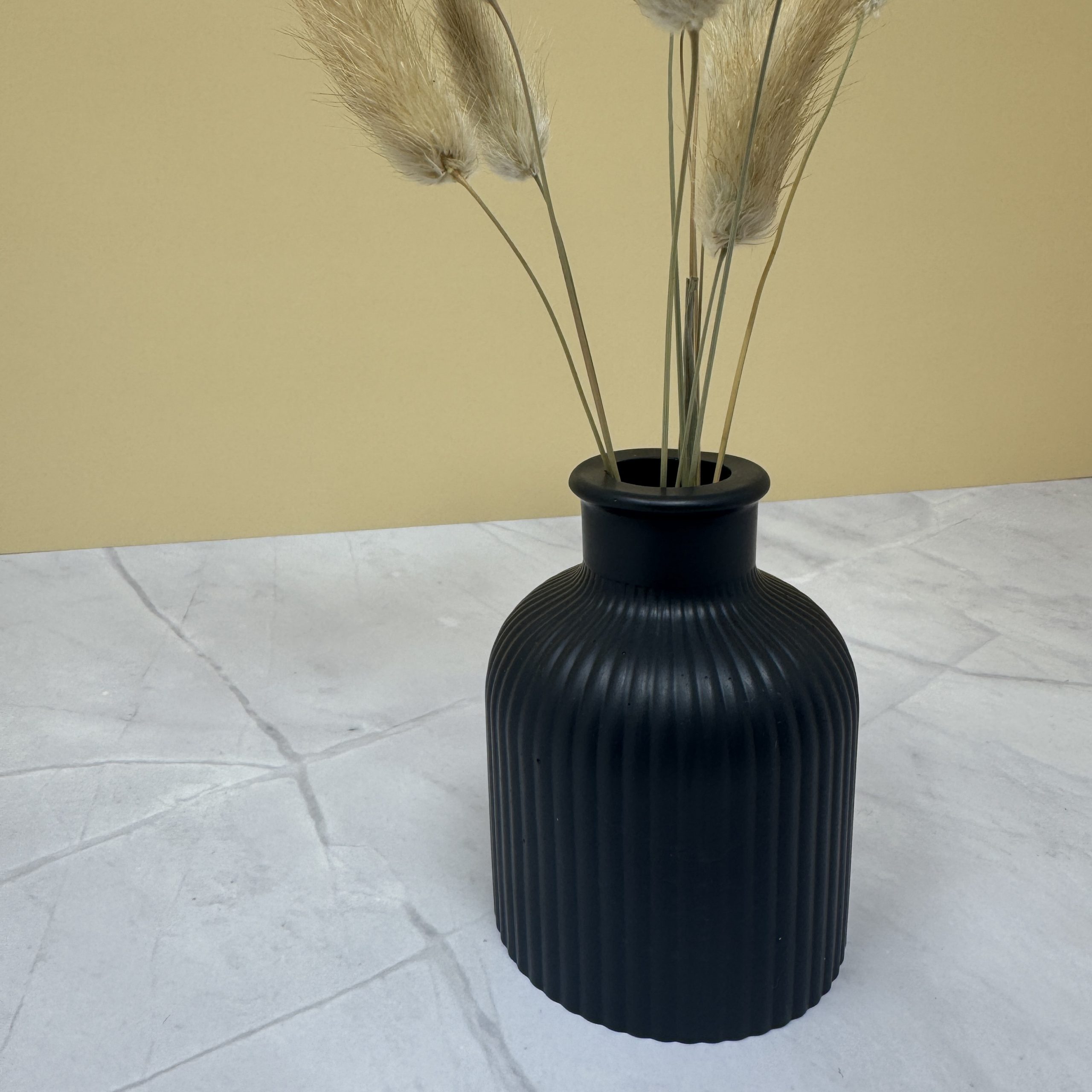 black ribbed vase close up