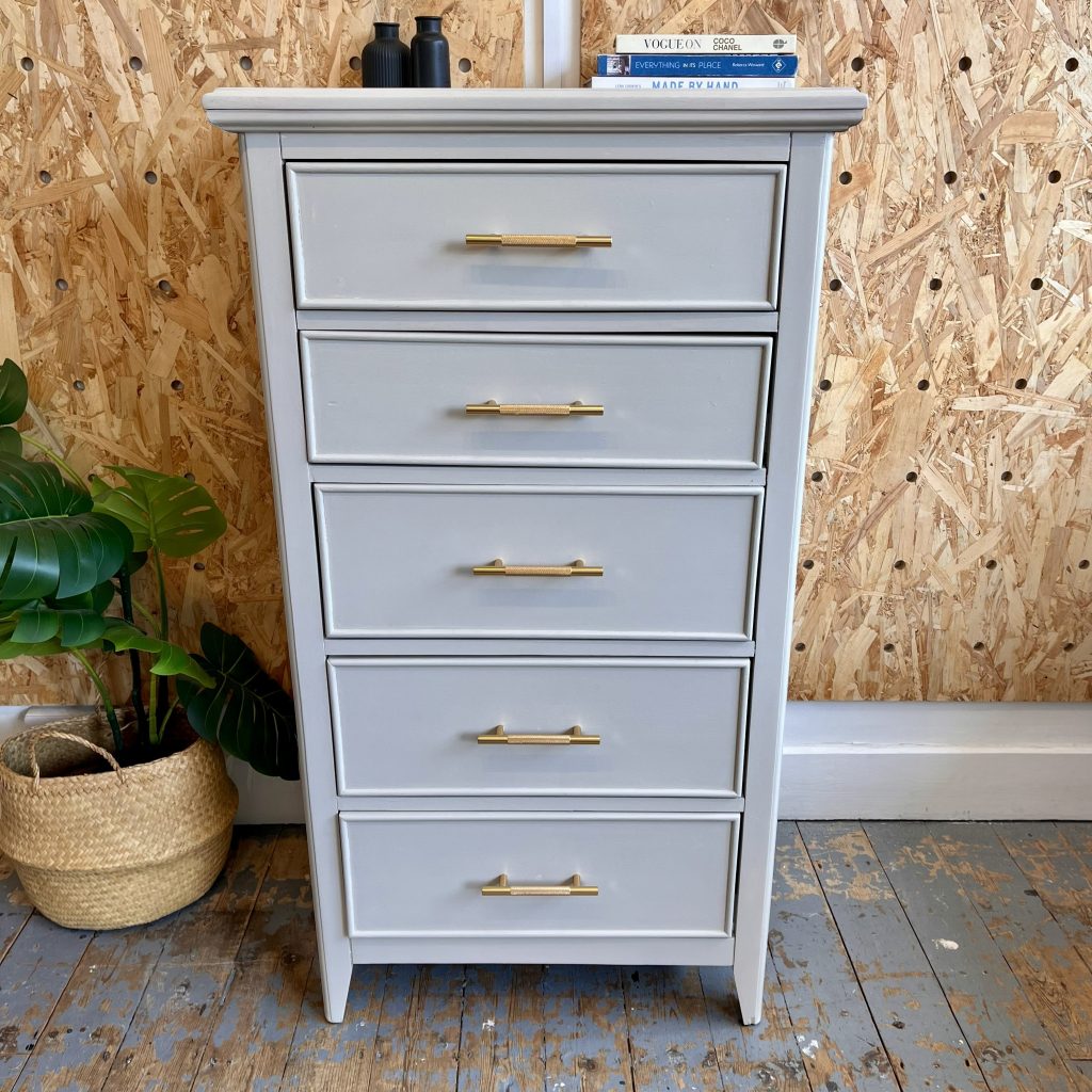 Natural stone chest of five drawers with gold handles
