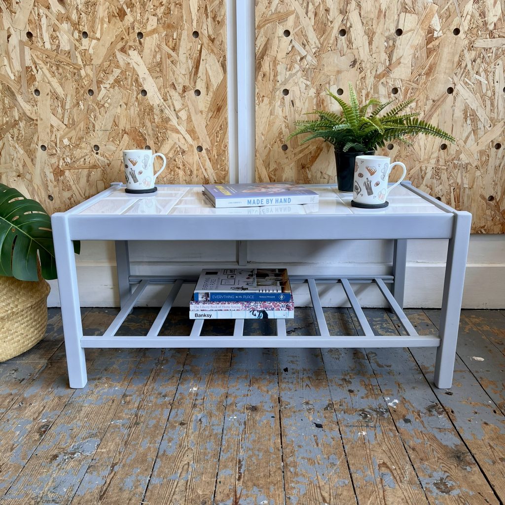 grey midcentury coffee table with white metro tile top